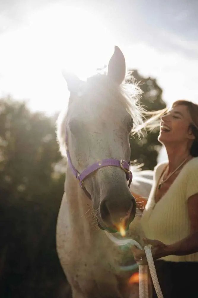 equine assisted horse with laughing therapist